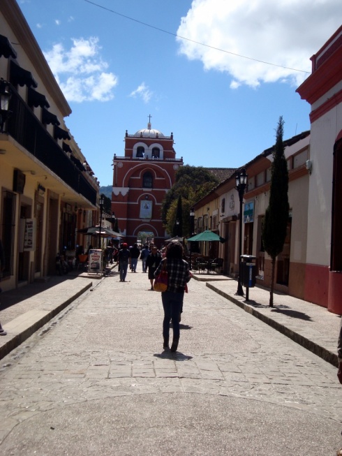 One of the pedestrian walkways in the town centre with the Arco de El Carmen (old gate) in the south of town.