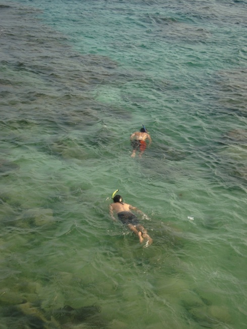 Rick and Jesus snorkeling over the reef opposite Coral View Hotel.