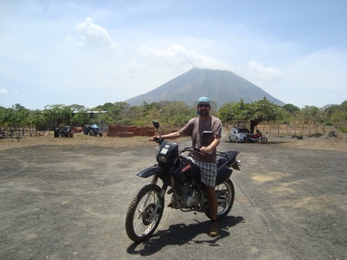 Rick and our bike for the day with Volcan Concepcion in the background.