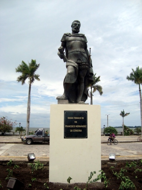 A statue of Francisco Hernandez de Cordoba, who founded the city of Granada in 1524. In the background is Lake Nicaragua.