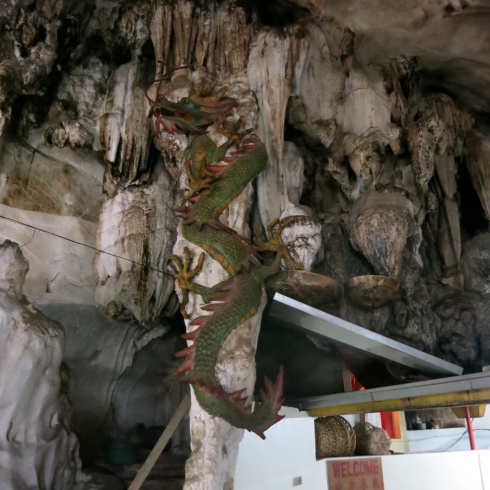 A dragon adorns this pillar in another Buddhist cave temple.