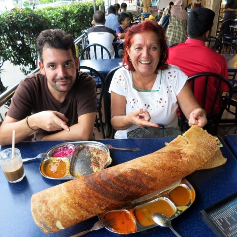 Eva arrived first, so we had time to kill while waiting for Pilar and Marissa. Here was her first ever introduction to Malaysian food. Check out this massive Thosai paper.