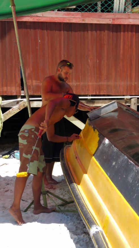 Gab and Amar working on restoring the boat. One of the projects at Moonlight.