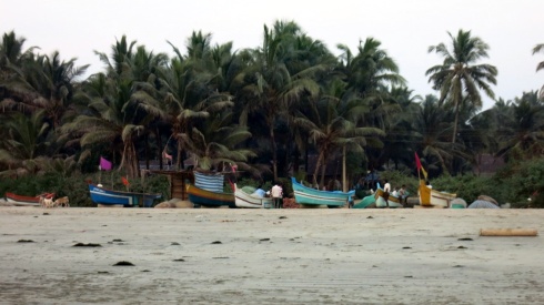 Fishermen fixing their nets further up the beach in Tarkarli.