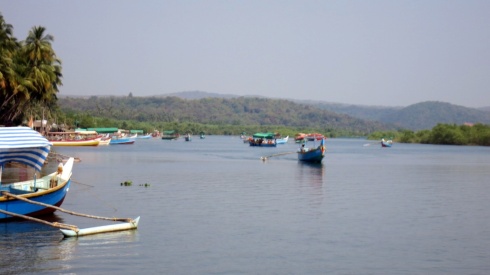 Local tourists enjoying a boat trip along the mouth of the river in Tarkarli.