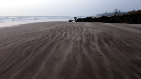Pretty patterns in the sand left by the waves on Karde beach.