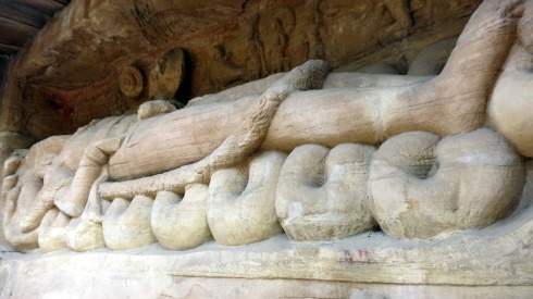 A figure of Vishnu resting at Cave 13.