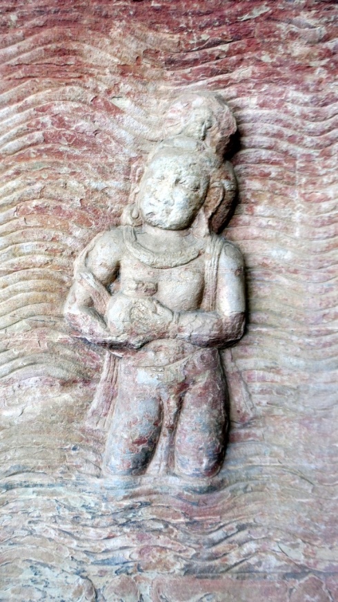 The earth goddess, Prithvi, emerging from the ocean.
