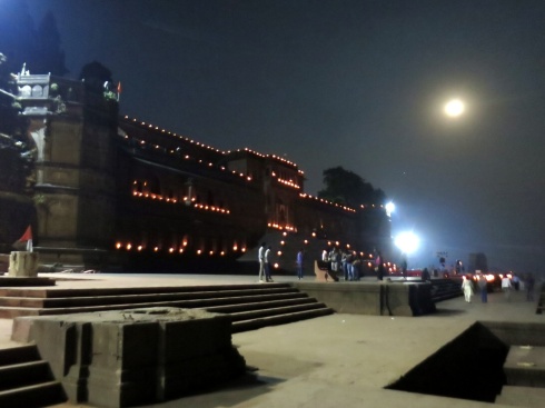 The walls of the fort at night illuminated with candles.
