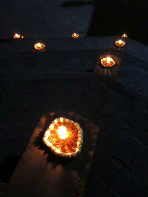 Candles illuminating the stairs at night.